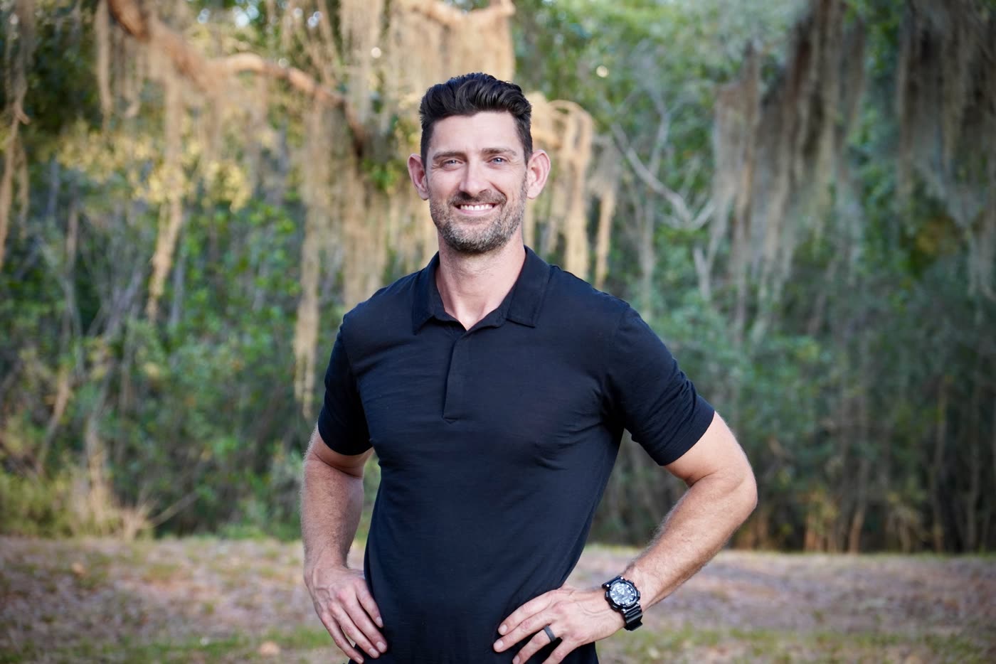 Dr. Dan Cooper standing outdoors in a focused portrait